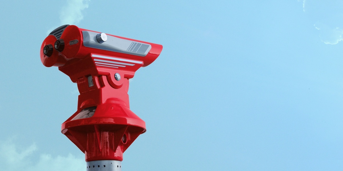 a red and silver telescope